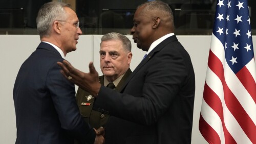 United States Secretary of Defense Lloyd Austin, right, greets NATO Secretary General Jens Stoltenberg, left, during a meeting of the Ukraine Defense Contact Group at NATO headquarters in Brussels, Thursday, June 15, 2023. NATO defense ministers hold two days of meetings.  To discuss their support for Ukraine and ways to strengthen the defenses of the allies of the eastern flank near Russia.  A meeting of the Ukraine Contact Group is held to drum up more military aid for the war-torn country.  (AP Photo/Virginia May)