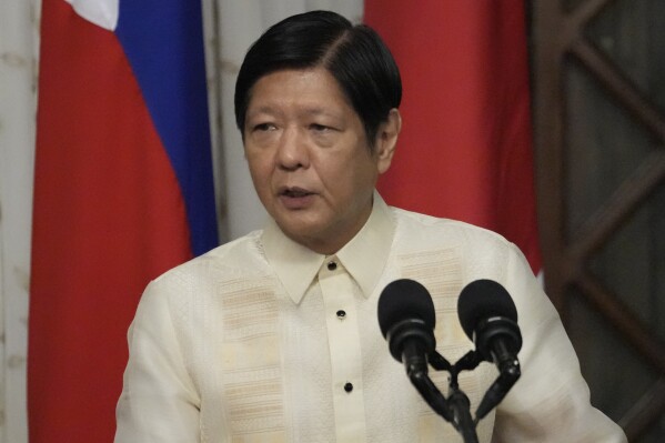 FILE - Philippine President Ferdinand Marcos Jr. talks beside Japanese Prime Minister Fumio Kishida, not shown, during their joint statement at the Malacanang presidential palace in Manila, Philippines on Nov. 3, 2023. Dozens of Filipinos fled from the war-ravaged Gaza Strip into Egypt through the Rafah crossing after Filipino diplomats negotiated for their safe passage and Qatar mediated for the border to be opened, Marcos said Wednesday, Nov. 8. (AP Photo/Aaron Favila, Pool, File)