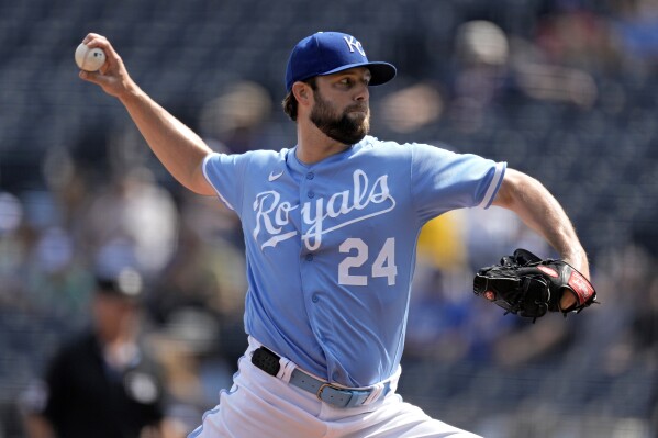 Kansas City Royals starting pitcher Jordan Lyles throws during the first inning of a baseball game against the Houston Astros Sunday, Sept. 17, 2023, in Kansas City, Mo. (AP Photo/Charlie Riedel)