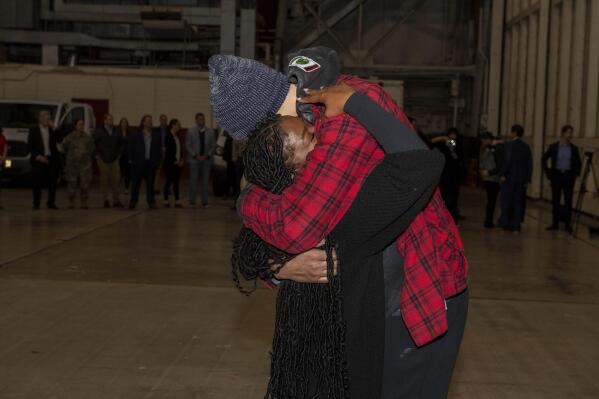 This photo provided by the U.S. Army shows WNBA star Brittney Griner, right, being greeted by wife Cherelle after arriving at Kelly Field in San Antonio following her release in a prisoner swap with Russia, Friday, Dec. 9, 2022. Griner said she's “grateful” to be back in the United States and plans on playing basketball again next season for the WNBA's Phoenix Mercury a week after she was released from a Russian prison and freed in a dramatic high-level prisoner exchange. “It feels so good to be home!” Griner posted to Instagram on Friday, Dec. 16, 2022, in her first public statement since her release. (Miquel A. Negron/U.S. Army via AP)
