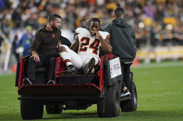 Cleveland Browns running back Nick Chubb is cared off the field with an injury during the first half of an NFL football game against the Pittsburgh Steelers Monday, Sept. 18, 2023, in Pittsburgh. (AP Photo/Matt Freed)