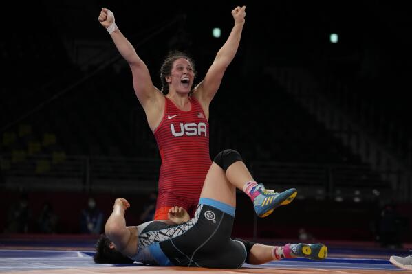 United States' Adeline Maria Gray, top, celebrates after winning against Kyrgyzstan's Aiperi Medet Kyzy during the semi-final round of the women's 76kg freestyle wrestling match at the 2020 Summer Olympics, Sunday, Aug. 1, 2021 in Chiba, Japan. (AP Photo/Aaron Favila)