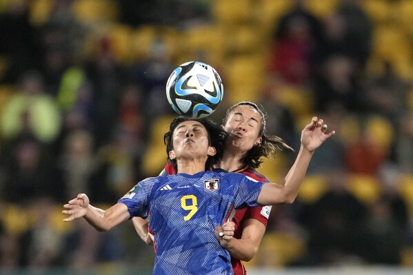 Japan's Riko Ueki, left, and Spain's Rocio Galvez go for a header during the Women's World Cup Group C soccer match between Japan and Spain in Wellington, New Zealand, Monday, July 31, 2023. (AP Photo/John Cowpland)