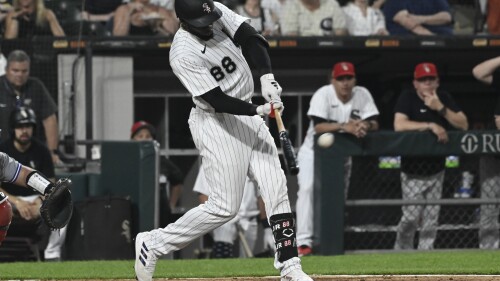 Chicago White Sox's Luis Robert Jr. hits a three-run home run against the Toronto Blue Jays during the sixth inning of a baseball game Tuesday, July 4, 2023, in Chicago. (AP Photo/Matt Marton)