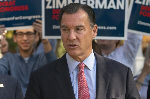 FILE - Rep. Tom Suozzi, D-N.Y., right, speaks during a news conference with a bipartisan group of current or former elected officials who support Robert Zimmerman's campaign, Nov. 7, 2022, in Great Neck, N.Y. Former U.S. Rep. Tom Suozzi will be the Democratic nominee in next year's special election to replace ousted congressman George Santos, New York Democrats announced Thursday, Dec. 7, 2023. (AP Photo/John Minchillo, File)