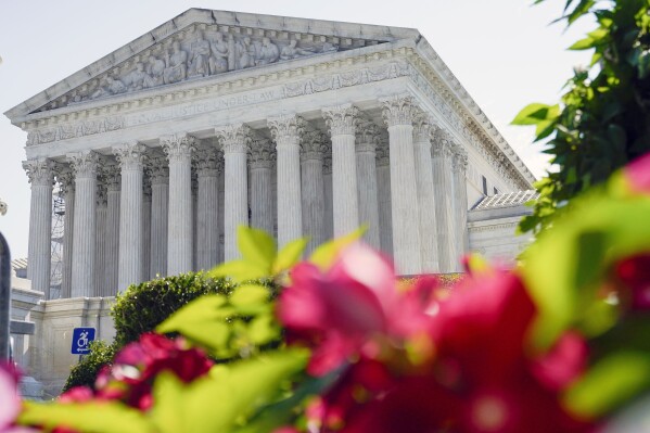 FILE - The U.S. Supreme Court is seen on July 13, 2023, in Washington. In arguments on Nov. 1, Supreme Court justices will weigh a California man's attempt to trademark a phrase mocking former President Donald Trump as "too small."(AP Photo/Mariam Zuhaib, File)