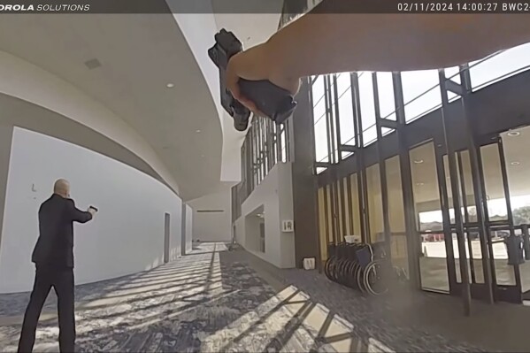 In this image taken from body camera video released by the Houston Police Department on Monday, Feb. 26, 2024, officers and security respond after exchanging gunfire with a woman who opened fire at celebrity pastor Joel Osteen鈥檚 Houston megachurch Sunday, Feb. 11. Police say Genesse Moreno, 36, entered the church between Sunday services with her 7-year-old son and began firing an AR-style rifle. (Houston Police Department via AP)