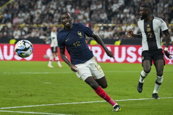 France's Randal Kolo Muani runs after the ball during the international friendly soccer match between Germany and France in Dortmund, Germany, Tuesday, Sept. 12, 2023. (AP Photo/Martin Meissner)