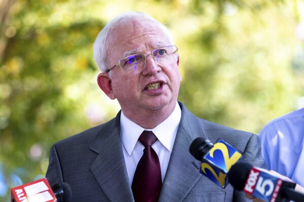 John Eastman, an attorney indicted with former President Donald Trump, makes a statement to media outside the Fulton County Jail in Atlanta, where he was booked on Tuesday, Aug. 22, 2023. (Arvin Temkar/Atlanta Journal-Constitution via AP)