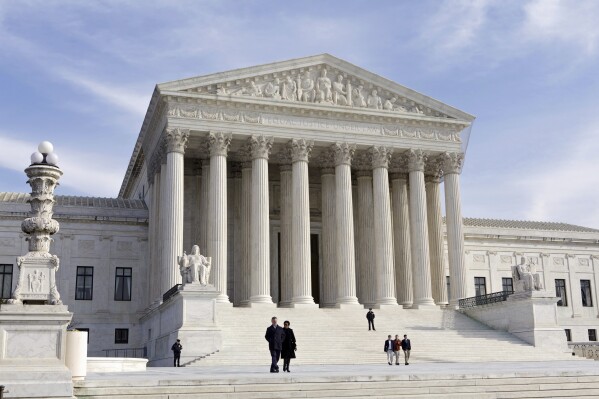 FILE - In this Jan. 25, 2012 file photo, the Supreme Court Building is seen in Washington. The Supreme Court is adopting its first code of ethics, in the face of sustained criticism over undisclosed trips and gifts from wealthy benefactors to some justices. The policy was issued by the court Monday. (AP Photo/J. Scott Applewhite, File)