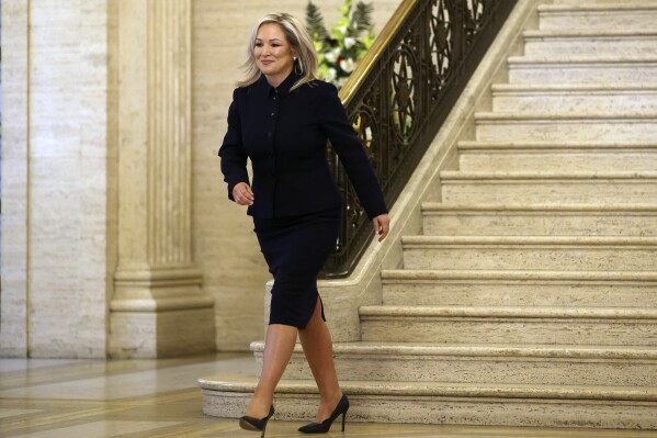 Sinn Fein Vice President Michelle O'Neill walks through Stormont Parliament Buildings in Belfast, Northern Ireland, Saturday, Feb. 3, 2024. O'Neill is poised to make history by becoming the first Irish nationalist leader of Northern Ireland as the government returned to work after a two-year boycott by unionists.(AP Photo/Peter Morrison)