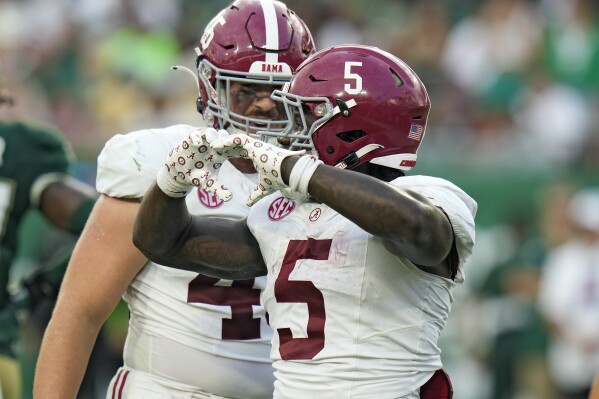 Alabama running back Roydell Williams (5) celebrates his score against South Florida with tight end Robbie Ouzts during the second half of an NCAA college football game Saturday, Sept. 16, 2023, in Tampa, Fla. (AP Photo/Chris O'Meara)