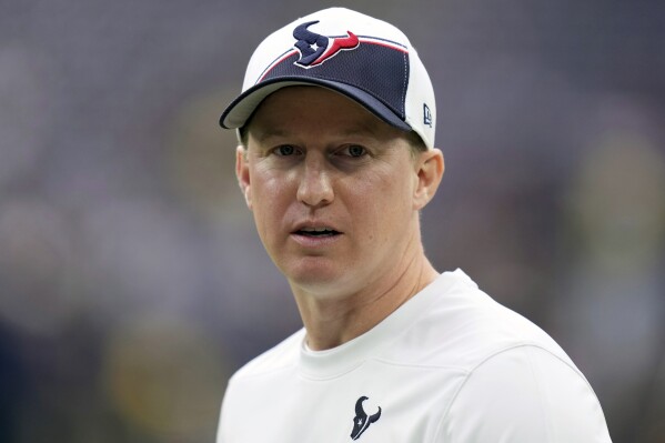 FILE - Houston Texans offensive coordinator Bobby Slowik walks on the field before an NFL football game against the Tennessee Titans, Sunday, Dec. 31, 2023, in Houston. Slowik is a finalist for The Associated Press 2023 Assistant Coach of the Year.(AP Photo/Eric Christian Smith, File)