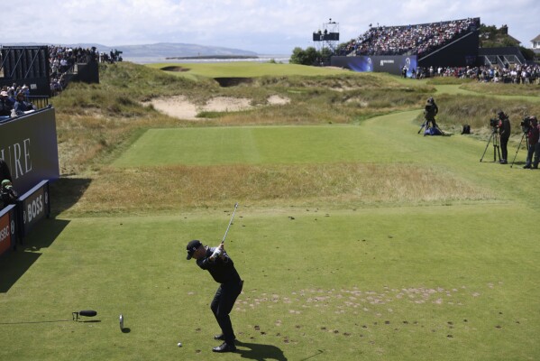 United States' Brian Harman plays his tee shot on the 17th hole during the second day of the British Open Golf Championships at the Royal Liverpool Golf Club in Hoylake, England, Friday, July 21, 2023. (AP Photo/Peter Morrison)
