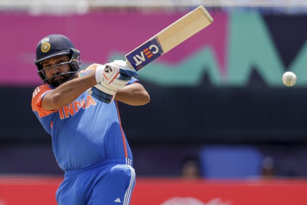 India captain Rohit Sharma plays a shot against Ireland during an ICC Men's T20 World Cup cricket match at the Nassau County International Cricket Stadium in Westbury, New York, Wednesday, June 5, 2024. (AP Photo/Adam Hunger)
