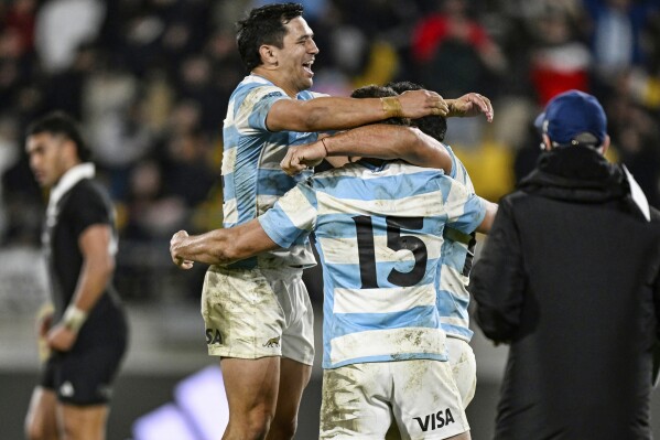 Argentina's players celebrate their win over New Zealand in their rugby union test match in Wellington, New Zealand on Saturday, Aug. 10, 2024. (Andrew Cornaga/Photosport via AP)