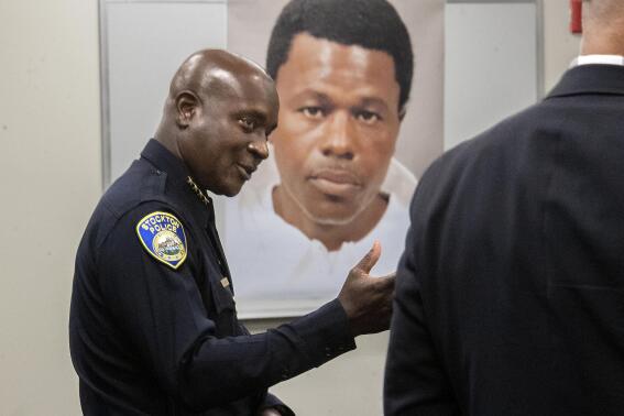 Stockton Police Chief Stanley McFadden speaks during a press conference at the Stockton Police Department headquarters in Stockton, Calif., on the arrest of suspect Wesley Brownlee in the Stockton serial killings on Saturday, Oct. 15, 2022. Behind McFadden is a booking photo of Brownlee. (Clifford Oto/The Record via AP)