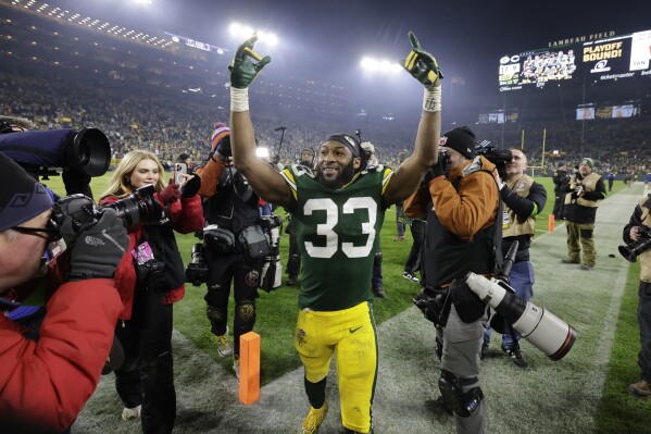 Green Bay Packers running back Aaron Jones (33) celebrates following an NFL football game against the Chicago Bears Sunday, Jan. 7, 2024, in Green Bay, Wis. The Packers won 17-9. (AP Photo/Mike Roemer)