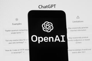 FILE - The OpenAI logo is seen on a mobile phone in front of a computer screen which displays the ChatGPT home Screen, on March 17, 2023, in Boston. Britain’s competition watchdog is opening a review of the artificial intelligence market, focusing on the technology underpinning chatbots like ChatGPT. The Competition Markets Authority said Thursday, May 4 it will look into the opportunities and risks of AI as well as the competition rules and consumer protections that may be needed. (AP Photo/Michael Dwyer, File)