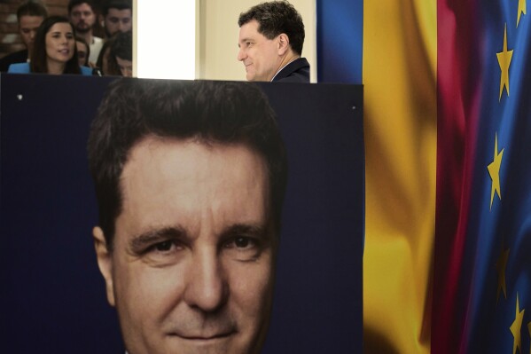 Presidential candidate Nicusor Dan holds a press conference the day after making it into the round of the country's presidential election redo in Bucharest, Romania, Monday, May 5, 2025. (AP Photo/Vadim Ghirda, File)