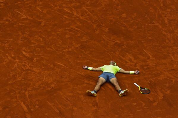 FILE - In this June 9, 2019 file photo, Spain's Rafael Nadal celebrates his record 12th French Open tennis tournament title after winning his men's final match against Austria's Dominic Thiem at the Roland Garros stadium in Paris. (AP Photo/Pavel Golovkin, File)
