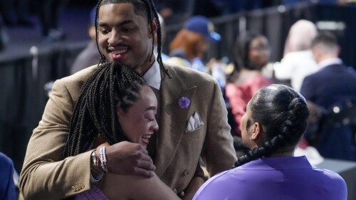 Jett Howard hugs family and friends after being selected 11th overall by the Orlando Magic during the NBA basketball draft, Thursday, June 22, 2023, in New York. (AP Photo/John Minchillo)
