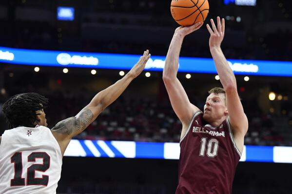 Bellarmine guard Garrett Tipton (10) shoots over Louisville forward JJ Traynor (12) during the first half of an NCAA college basketball game in Louisville, Ky., Wednesday, Nov. 9, 2022. (AP Photo/Timothy D. Easley)