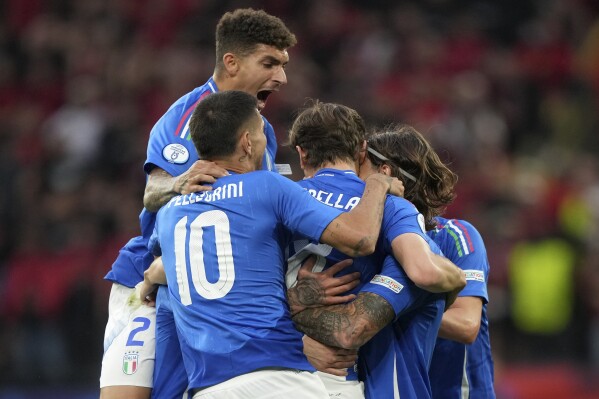 Italian players celebrate after Italy's Nicolo Barella scored his side's second goal during the Group B match between Italy and Albania at the Euro 2024 soccer tournament in Dortmund, Germany, Saturday, June 15, 2024. (AP Photo/Martin Meissner)