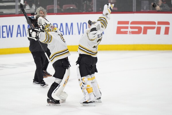 Boston Bruins goaltenders Jeremy Swayman, left, Linus Ullmark celebrate after the Bruins beat the Florida Panthers 5-1 in Game 1 of the second-round series of the Stanley Cup Playoffs, Monday, May 6, 2024, in Sunrise, Fla. (AP Photo/Wilfredo Lee)