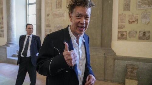 United States' artist Andres Serrano arrives to meet reporters after being received by Pope Francis on the occasion of the 50th anniversary of the creation of the Contemporary Art section of the Vatican Museum, at the Vatican, Friday, June 23, 2023. Some 200 artists were received by the Pope at the Vatican on the 50th anniversary of the creation of the modern religious art collection opened on June 23, 1973 by Pope Paul VI that includes works from artists such as Van Gogh, Gauguin, Bacon, Botero, Rodin, De Chirico, Severini, Guttuso, Matisse and others. (AP Photo/Andrew Medichini)