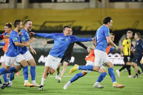 Klaksvik's Claes Philip Kronberg, center, and his teammates celebrate winning the Champions League second qualifying round, 2nd leg soccer match between Swedish team BK Hacken and KI Klaksvik of the Faroe Islands at the Bravida Arena in Gothenburg, Sweden, Wednesday, August 2, 2023. (Adam Ihse/TT News Agency via AP)