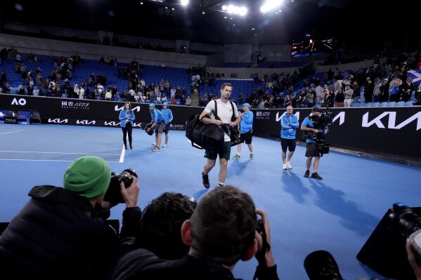 FILE - Andy Murray of Britain leaves Margaret Court Arena after 4 a.m. on Jan. 20, 2023, following his five set win over Australia's Thanasi Kokkinakis at the Australian Open tennis championships in Melbourne, Australia. The Australian Open will begin on a Sunday next year and expand to a 15-day event for the first time. Tennis Australia announced the change on Monday, Oct. 2, 2023, saying its intention is to decrease the likelihood of late-night finishes for the athletes and spectators. (AP Photo/Ng Han Guan, File)