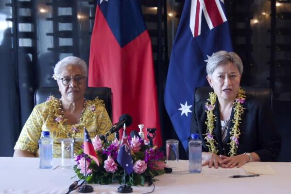 In this photo taken from video supplied by the Australian Department of Foreign Affairs, Australian Foreign Minister Penny Wong, right, holds a joint press conference with Samoan Prime Minister Fiame Naomi Mata’afa in Apia, Samoa, Thursday, June 2, 2022. (Australian Department of Foreign Affairs via AP)
