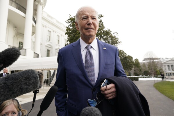 President Joe Biden speaks to the media before boarding Marine One on the South Lawn of the White House, Thursday, Jan. 18, 2024, in Washington. Biden is traveling to North Carolina to highlight $82 million in new investments that would connect 16,000 households and businesses to high-speed internet. (AP Photo/Yuri Gripas)
