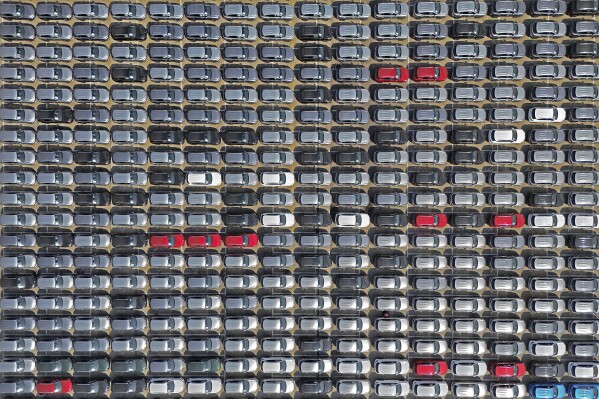 Aerial view of new cars awaiting shipping in a pier for 