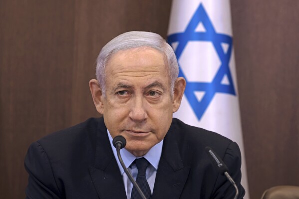 Israeli Prime Minister Benjamin Netanyahu chairs a weekly cabinet meeting at his office in Jerusalem Sunday, Aug. 27, 2023 (Menahem Kahana/Pool Photo via AP)