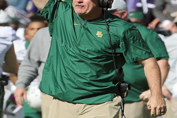 This undated photo shows Baylor associate head coach Joey McGuire during an NCAA college football game in Waco, Texas. Texas Tech is finalizing a deal to hire Baylor assistant and longtime Texas high school coach Joey McGuire as its next head coach. A person familiar with knowledge of the decision told The Associated Press on Monday, Nov. 8, 2021, that Tech was planning to announce the hiring of McGuire soon. The person spoke on condition of anonymity because details of an agreement were still be completed.  (Jerry Larson/Waco Tribune Herald, via AP)