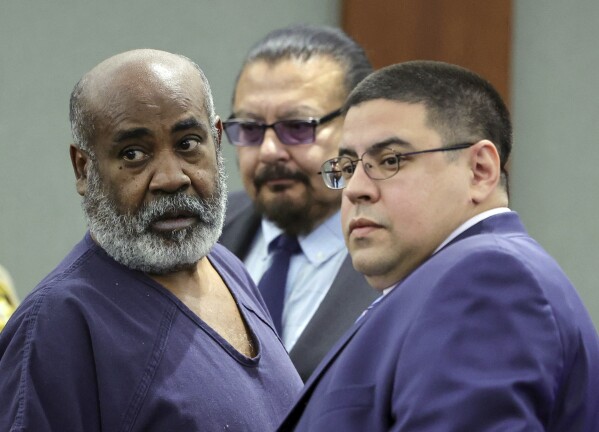 Duane Keith “Keffe D” Davis, left, with deputy special public defenders Robert Arroyo, right, and Charles Cano, rear, appears for his arraignment at the Regional Justice Center, Thursday, Nov. 2, 2023, in Las Vegas. Davis, a former Southern California street gang leader, pleaded not guilty Thursday to orchestrating a drive-by shooting that killed Tupac Shakur in 1996 in Las Vegas. (Ethan Miller/Pool Photo via AP)