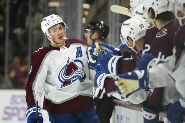 Colorado Avalanche defenseman Cale Makar celebrates his goal against the Arizona Coyotes with teammates during the first period of an NHL hockey game, Thursday, Nov. 30, 2023, in Tempe, Ariz. (APPhoto/Ross D. Franklin)