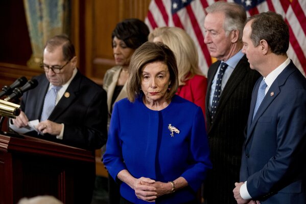 House Speaker Nancy Pelosi of Calif., center, accompanied by Chairman of the House Judiciary Committee Jerrold Nadler, D-N.Y., left, Chairwoman of the House Financial Services Committee Maxine Waters, D-Calif., second from left, Chairwoman of the House Oversight and Reform Committee Carolyn Maloney, D-N.Y., third from right, Chairman of the House Ways and Means Committee Richard Neal, D-Mass., second from right, and Chairman of the House Intelligence Committee Adam Schiff, D-Calif., right, appear at a news conference to unveil articles of impeachment against President Donald Trump, abuse of power and obstruction of Congress, Tuesday, Dec. 10, 2019, on Capitol Hill in Washington. (AP Photo/Andrew Harnik)