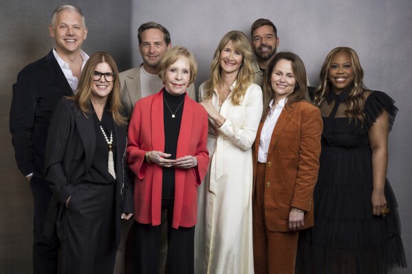 FILE - Abe Sylvia, from left, Executive producer Katie O'Connell, Josh Lucas, Carol Burnett, Laura Dern, Ricky Martin, Jayme Lemons and Amber Chardae Robinson pose for a portrait to promote the Apple TV+ television miniseries "Palm Royale" during the Winter Television Critics Association Press Tour on Monday, Feb. 5, 2024, at The Langham Huntington Hotel in Pasadena, Calif. (Willy Sanjuan/Invision/AP, File)