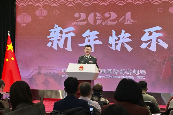 China's Defense Ministry spokesperson Col. Wu Qian speaks to reporters at a monthly briefing in Beijing, Thursday, Dec. 28, 2023. Weeks before Taiwan holds elections for its president and legislature, China renewed its threat to use military force to annex the self-governing island democracy it claims as its own territory. (AP Photo/Emily Wang Fujiyama)