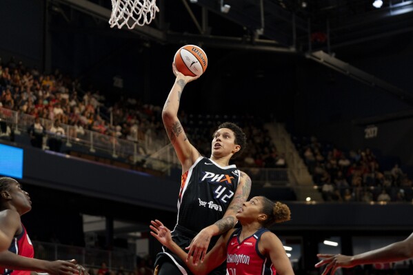 Phoenix Mercury center Brittney Griner (42) makes a layup during the second quarter of a WNBA basketball game against the Washington Mystics, Sunday, July 23, 2023, in Washington. (AP Photo/Stephanie Scarbrough)