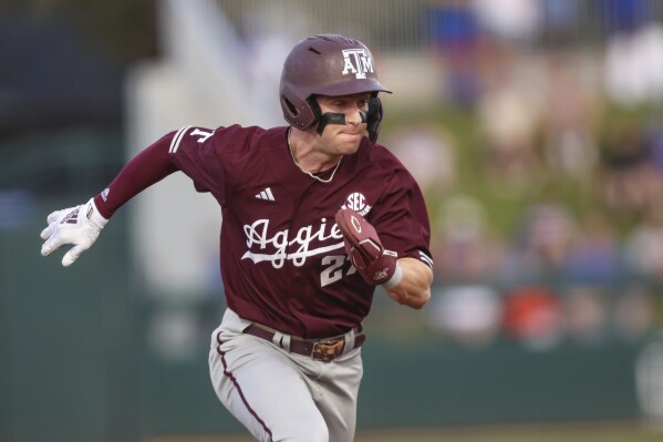 FILE -Texas A&M's Ted Burton (27) runs to third during an NCAA baseball game against Florida, Saturday, March 16, 2024, in Gainesville, Fla. Burton hit four home runs in nine plate appearances in the first two games of a Friday-Saturday, April 26-27, 2024, series against Georgia. He doubled his season total to eight. (AP Photo/Gary McCullough, File)