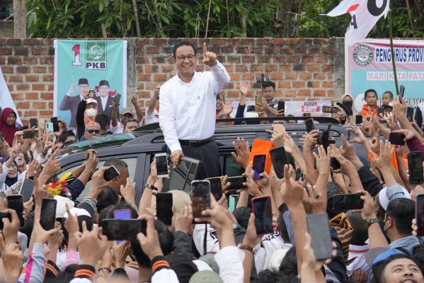 Presidential candidate Anies Baswedan greets supporters during his campaign rally in Bandar Lampung, Indonesia, Sunday, Jan. 14, 2024. The former Jakarta governor seeking Indonesia's presidency said democracy is declining in the country and pledged to make changes to get it back on track. (AP Photo/Achmad Ibrahim)