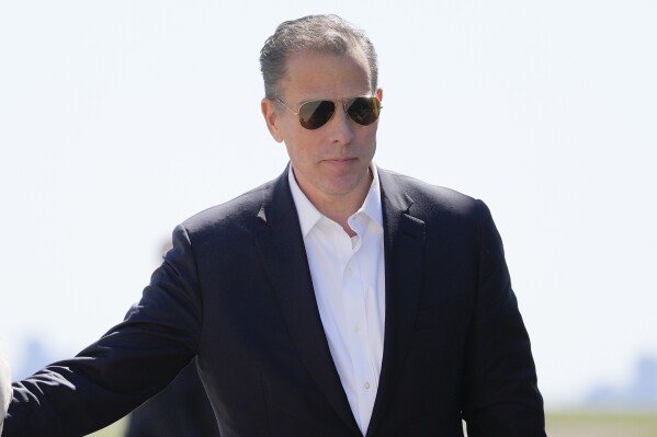 FILE - Hunter Biden walks to board Air Force One at John F. Kennedy International Airport, March 29, 2024, in New York. Hunter Biden's lawyers are pressing a judge to delay his trial on federal tax charges that's set to begin next month in Los Angeles. (AP Photo/Alex Brandon, File)
