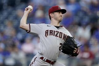 FILE - Arizona Diamondbacks starting pitcher Zach Davies throws during the first inning of the team's baseball game against the Kansas City Royals on Aug. 23, 2022, in Kansas City, Mo. The Diamondbacks and Davies have agreed to a $5 million, one-year contract that includes a mutual option for 2024, according to a person familiar with the deal. The person spoke to The Associated Press on condition of anonymity Wednesday, Jan. 4, because the move had not been announced. (AP Photo/Charlie Riedel, File)