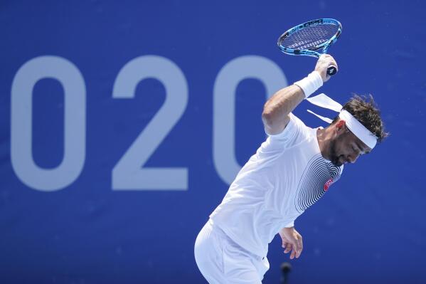 Fabio Fognini, of Italy, throws his racket during a third round men's tennis match against Daniil Medvedev, of the Russian Olympic Committee, at the 2020 Summer Olympics, Wednesday, July 28, 2021, in Tokyo, Japan. (AP Photo/Patrick Semansky)
