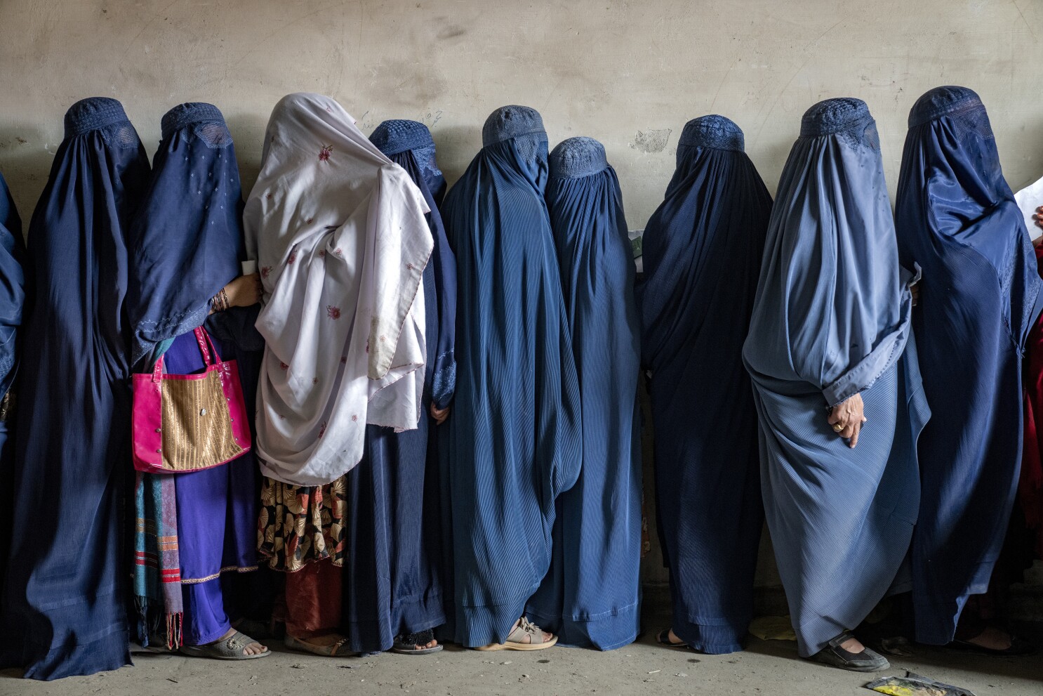 Taliban decrees on clothing and male guardians leave Afghan women scared to  go out alone, says UN | AP News
