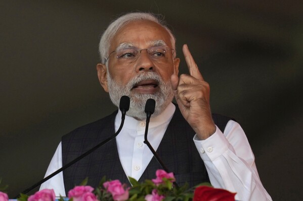 FILE- Indian Prime Minister Narendra Modi speaks at a rally in Mumbai, India, Thursday, Jan. 19, 2023. Modi says his country strongly condemns the civilian deaths taking place during the Israel-Hamas war. During his speech at a virtual summit of more than 100 developing countries Friday, Nov. 17, 2023, Modi urged the leaders of the developing countries to unite in the face of growing challenges rising due to the war. Modi also condemned the Oct. 7 attack by the militant group Hamas. (AP Photo/Rafiq Maqbool, File)